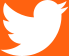 Twitter logo in front of an orange background